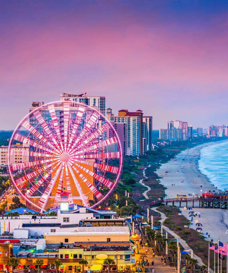 The Myrtle Beach boardwalk and SkyWheel at sunset